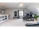 Bonus room setup as home office with desk, fitness equipment and lots of natural light at 10709 Thornbury Crest Ct, Raleigh, NC 27614