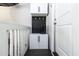 Practical mud room area with cabinet and mounted hooks for coats and shoes at 10709 Thornbury Crest Ct, Raleigh, NC 27614