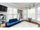 Comfortable playroom filled with natural light, a comfortable couch, and ample toy storage at 10709 Thornbury Crest Ct, Raleigh, NC 27614