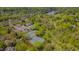 Gorgeous community aerial view with tennis courts, lake, lush landscaping, and beautiful homes at 109 Jones Creek Pl, Chapel Hill, NC 27516