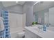 Cozy bathroom featuring a shower-tub combo and ample natural light, perfect for relaxation at 109 Jones Creek Pl, Chapel Hill, NC 27516