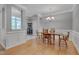 Elegant dining room with hardwood floors, wainscoting, and chandelier at 109 Jones Creek Pl, Chapel Hill, NC 27516