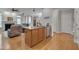 Stylish kitchen with central island seamlessly connects to the living area at 109 Jones Creek Pl, Chapel Hill, NC 27516