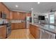 Spacious kitchen boasts stainless steel appliances, granite countertops, and ample cabinet space at 109 Jones Creek Pl, Chapel Hill, NC 27516