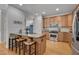 Open-concept kitchen with a large island featuring a sink and seating at 109 Jones Creek Pl, Chapel Hill, NC 27516
