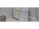Efficient laundry room with white washer and dryer units at 109 Jones Creek Pl, Chapel Hill, NC 27516
