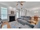 Inviting living room featuring hardwood floors, fireplace, and access to dining room at 109 Jones Creek Pl, Chapel Hill, NC 27516
