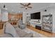 Cozy living room view into a kitchen with stainless steel appliances at 109 Jones Creek Pl, Chapel Hill, NC 27516