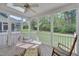 Relaxing screened porch with wicker furniture and open views, ideal for enjoying the outdoors in comfort at 109 Jones Creek Pl, Chapel Hill, NC 27516