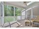 Inviting screened porch with comfortable wicker seating and serene outdoor views, perfect for relaxing at 109 Jones Creek Pl, Chapel Hill, NC 27516