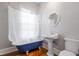 Stylish bathroom with a vintage clawfoot tub, pedestal sink, and modern fixtures at 1105 W Lenoir St, Raleigh, NC 27603