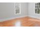 Inviting bedroom boasting hardwood floors and abundant natural light from two windows at 1105 W Lenoir St, Raleigh, NC 27603