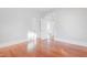 Bright and airy bedroom showcasing hardwood floors and freshly painted white walls at 1105 W Lenoir St, Raleigh, NC 27603