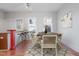 Bright dining room featuring wood floors, neutral walls, and updated furnishings and modern lighting at 1105 W Lenoir St, Raleigh, NC 27603