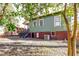Home exterior showcases a wooden deck, classic siding, and a well-maintained gravel yard at 1105 W Lenoir St, Raleigh, NC 27603