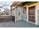 Charming front porch with painted floors and railing, providing a welcoming entryway at 1105 W Lenoir St, Raleigh, NC 27603