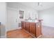Kitchen area featuring an eat-in counter, wood cabinets, and a ceiling fan at 1105 W Lenoir St, Raleigh, NC 27603