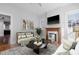 Bright living room with fireplace, hardwood floors, and neutral decor at 1105 W Lenoir St, Raleigh, NC 27603