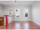 Spacious living room with hardwood floors, white trim and large windows offering an abundance of natural light at 1105 W Lenoir St, Raleigh, NC 27603