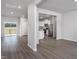 Bright and spacious living room open to kitchen featuring stylish wood-look flooring at 11430 International Dr, Middlesex, NC 27557