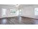 Bright living room with ample natural light and luxury vinyl plank flooring at 11450 International Dr, Middlesex, NC 27557