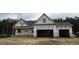 New construction home featuring a two-car garage and covered porch at 115 Sanders Farm Dr, Smithfield, NC 27577
