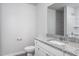 Bathroom featuring a granite countertop vanity, mirror, toilet, and standup shower at 11682 International Dr, Middlesex, NC 27557