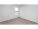 An empty bedroom includes carpet flooring and a window with a view to the outside at 11682 International Dr, Middlesex, NC 27557