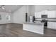 Bright, open kitchen boasts granite counters, stainless appliances, and white cabinetry at 11740 International Dr, Middlesex, NC 27557