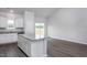 Kitchen featuring white cabinets, granite countertops, and a kitchen island at 11740 International Dr, Middlesex, NC 27557