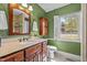 Bathroom featuring vanity with a single sink and a walk-in shower at 118 Shannon Dr, Burlington, NC 27215