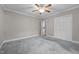 Spacious bedroom featuring neutral walls, carpet flooring, and a ceiling fan at 118 Shannon Dr, Burlington, NC 27215