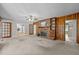 Spacious living room featuring a brick fireplace, wooden accents, and ample natural light at 118 Shannon Dr, Burlington, NC 27215