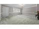 Bright living room with plantation shutters, crown molding, and a neutral color palette at 118 Shannon Dr, Burlington, NC 27215