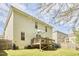 Rear exterior showing spacious deck and manicured yard with two-story home at 1201 Bellenden Dr, Durham, NC 27713