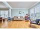 Bright living area with hardwood floors and multiple windows at 1201 Bellenden Dr, Durham, NC 27713