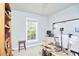 Functional home office space with a large window, computer setup, and organized shelving for productivity at 1201 Bellenden Dr, Durham, NC 27713