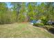 Large backyard with fencing and an above ground swimming pool at 1503 Anterra Dr, Wake Forest, NC 27587