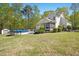 Expansive backyard featuring an above-ground pool, deck, and screened porch for outdoor enjoyment at 1503 Anterra Dr, Wake Forest, NC 27587