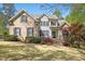 Beautiful brick and siding two-story home with manicured landscaping and inviting front entrance at 1503 Anterra Dr, Wake Forest, NC 27587