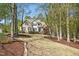 Traditional two-story brick home with a manicured front yard and lush landscaping at 1503 Anterra Dr, Wake Forest, NC 27587