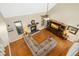 Bright living room features fireplace, hardwood floors, and large entertainment center at 1503 Anterra Dr, Wake Forest, NC 27587
