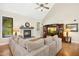Bright living room with vaulted ceilings, fireplace, entertainment center, and large windows at 1503 Anterra Dr, Wake Forest, NC 27587