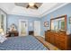 Relaxing bedroom with a tray ceiling, blue walls, and wooden furniture at 1503 Anterra Dr, Wake Forest, NC 27587