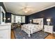 Comfortable bedroom with hardwood floors, bay window, and custom closet at 1545 Heritage Links Dr, Wake Forest, NC 27587