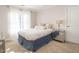 Cozy bedroom with neutral carpet, a mirrored nightstand, and white crown molding at 1545 Heritage Links Dr, Wake Forest, NC 27587