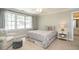 Bright bedroom features a large window, comfortable seating, and neutral carpet at 1545 Heritage Links Dr, Wake Forest, NC 27587