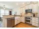 Gourmet kitchen with stainless steel appliances and custom cabinets at 1545 Heritage Links Dr, Wake Forest, NC 27587