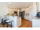 Bright kitchen with granite countertops, stainless steel appliances, and a breakfast bar at 1545 Heritage Links Dr, Wake Forest, NC 27587