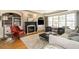 Inviting living room features a fireplace, built-in shelving, and large windows at 1545 Heritage Links Dr, Wake Forest, NC 27587